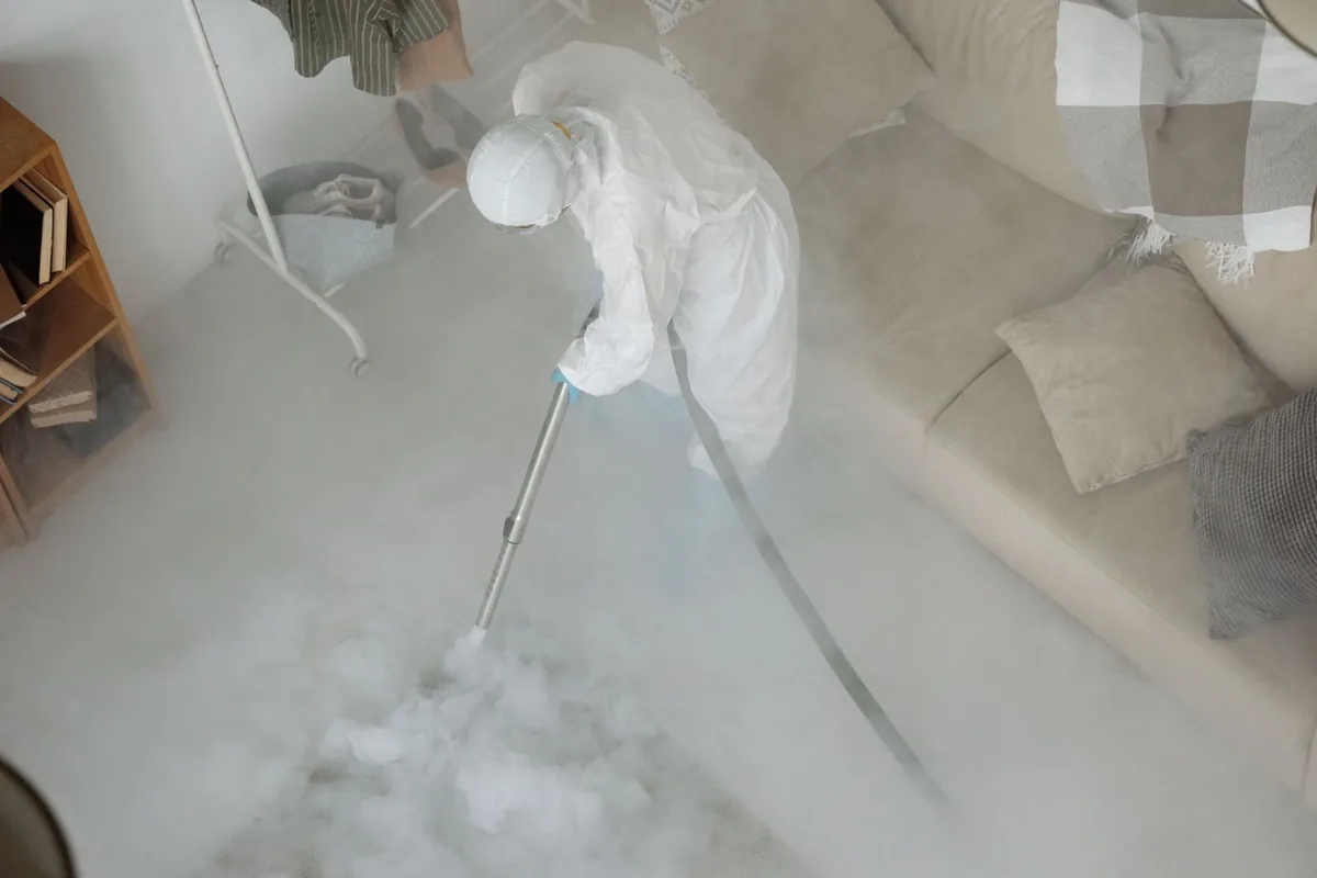 Biohazard cleanup technician in protective equipment, Ama, LA